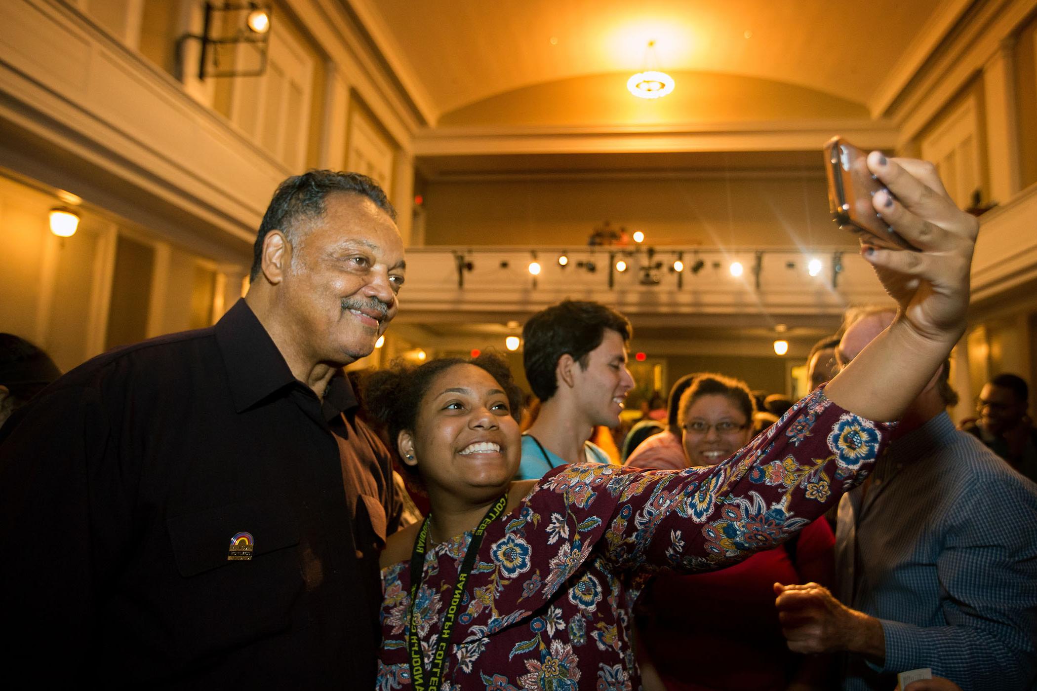 Rev. Jesse Jackson meets with students during a campus visit.